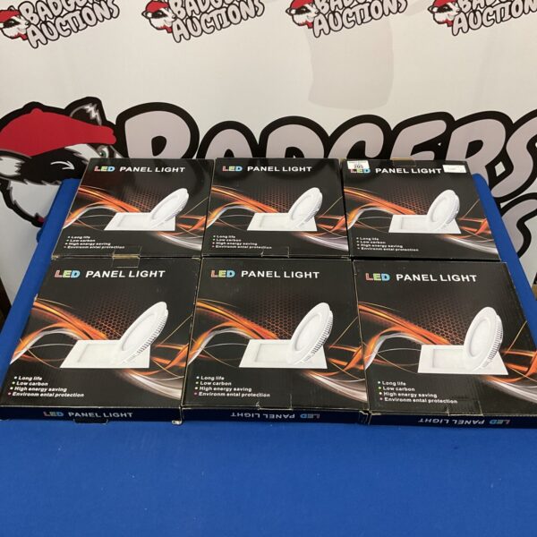 Six boxes of LED light panels for commercial or home lighting.