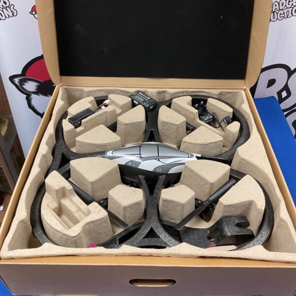 Parrot AR Drone 2.0 quadcopter in protective foam packaging.