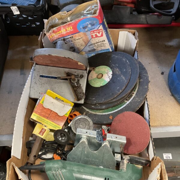 Bosch sander and assorted cutting discs in a tool lot.