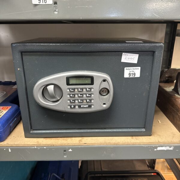Front view of a steel valuables safe with digital keypad.