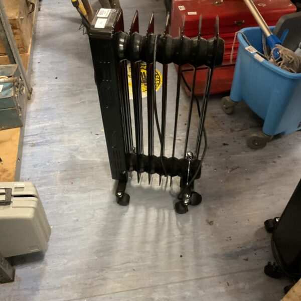Black Logik oil radiator with multiple fins for efficient heating.