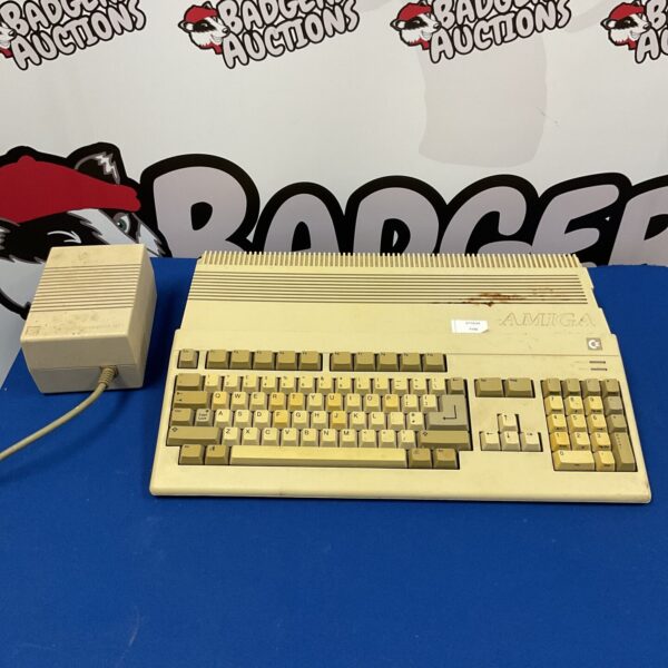 Vintage Commodore Amiga A500 computer with keyboard and casing.