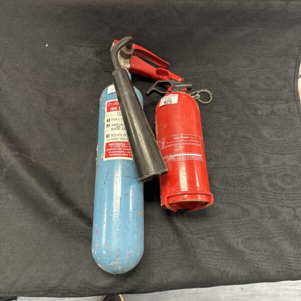 Vintage red fire extinguisher with "925" marking, collectible item.