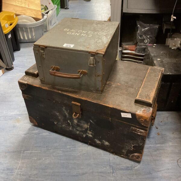 Pair of vintage military wooden chests with wear.