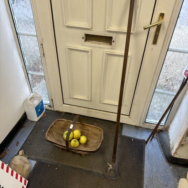 Vintage garden trug and fruit picking stick set displayed indoors.