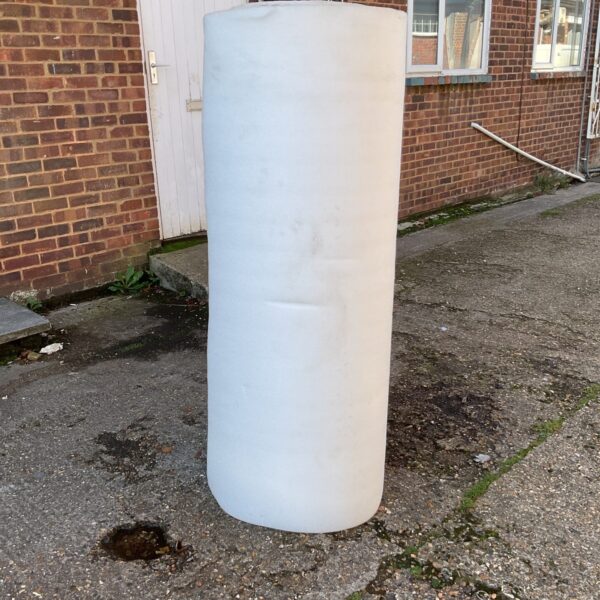 White roll of underlay foam for flooring projects.