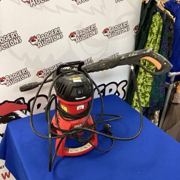 Front view of a red and black Homelite pressure washer.