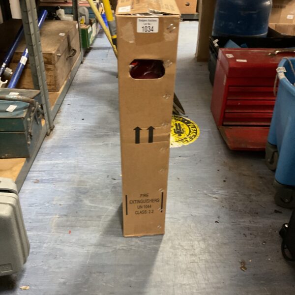 Vintage boxed fire extinguisher, antique fire safety equipment.