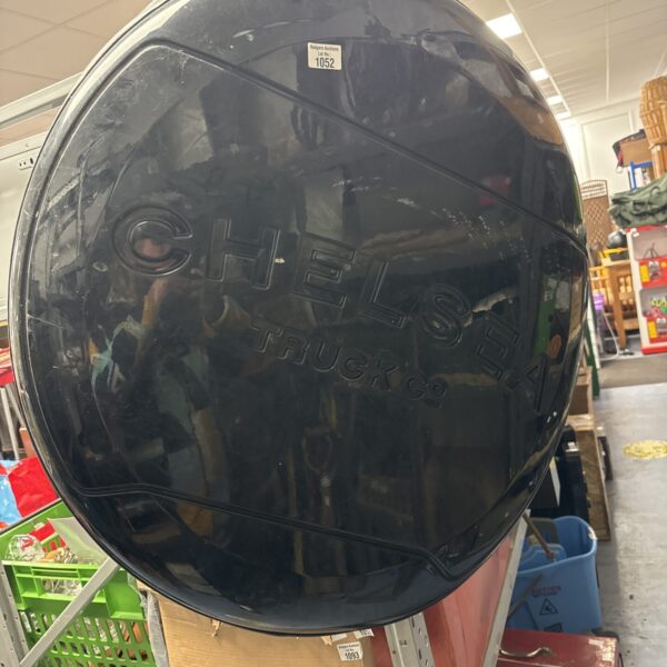 Black Chelsea Truck Co spare wheel cover with branding.