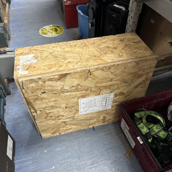 Empty chipboard storage box for freight or DIY projects.