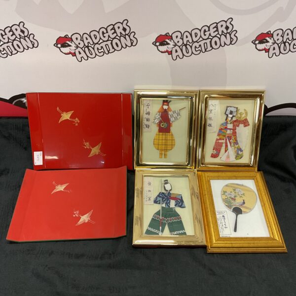 Framed depictions of traditional Japanese costumes in a vintage collection.