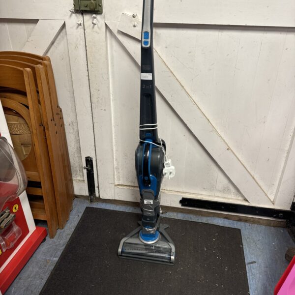 Black & Decker cordless vacuum cleaner with charging stand.