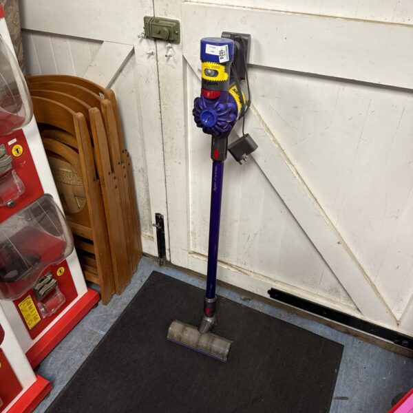 Dyson V7 Animal cordless vacuum cleaner in a home setting.