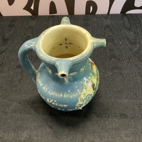 Vintage three-way ceramic drinking mug with three spouts.