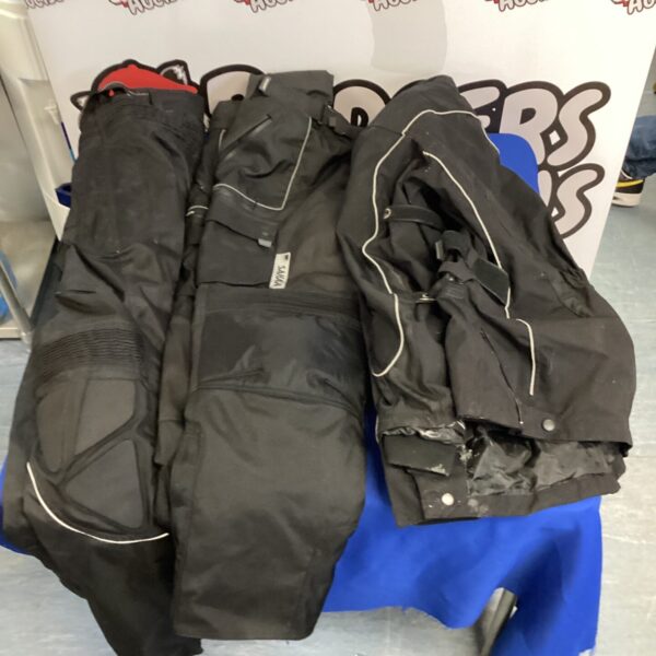 Motorcycle waterproof trousers and jacket for riding comfort.