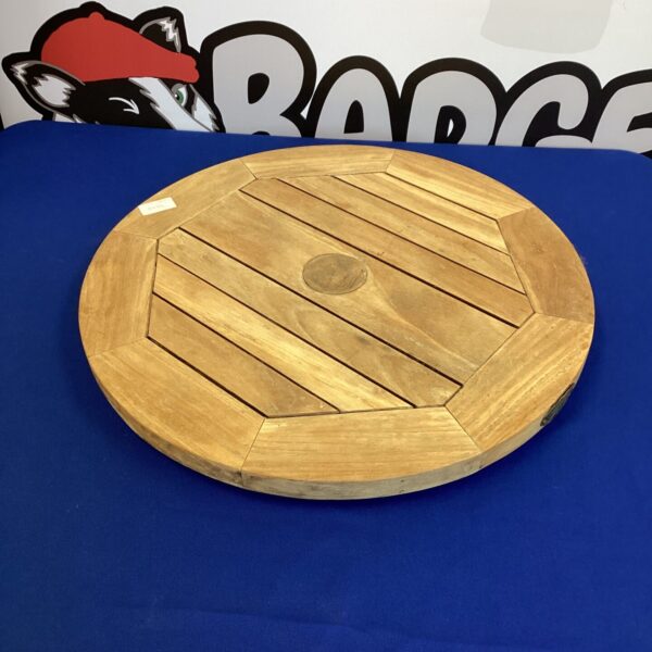 Rustic wooden lazy Susan serving tray for dining or patio use.