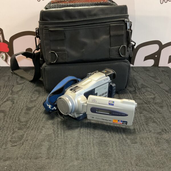 Vintage Sony DCR-TRV16 MiniDV camcorder with strap.