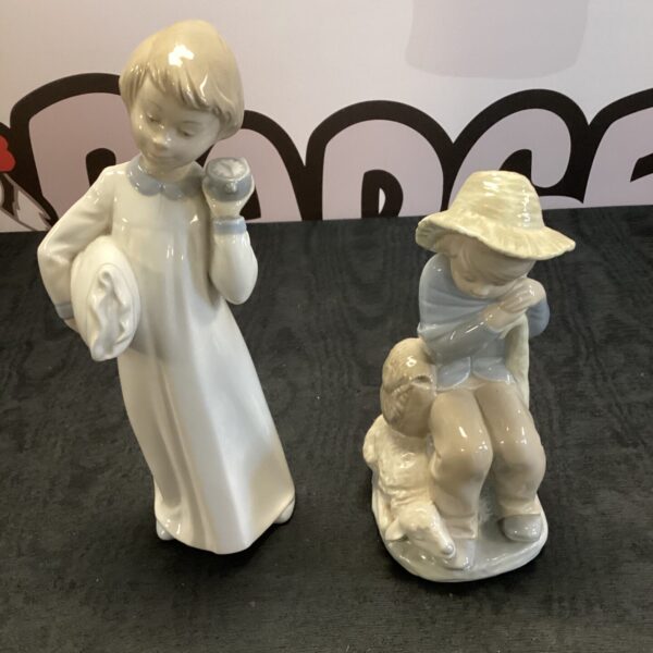 Vintage Zaphones porcelain figurines of a boy and girl.