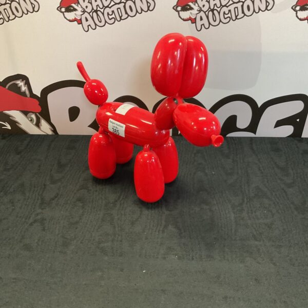 Red robot poodle toy, interactive and collectible.