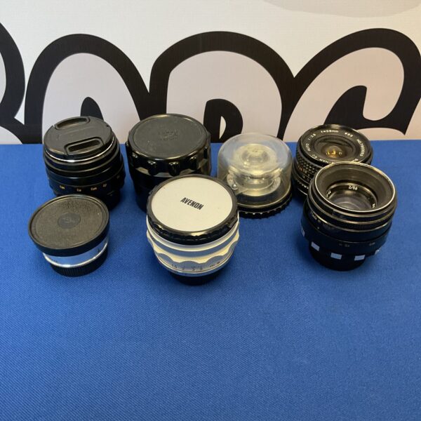 Mixed lot of vintage camera lenses including Avenon and Albinar brands.