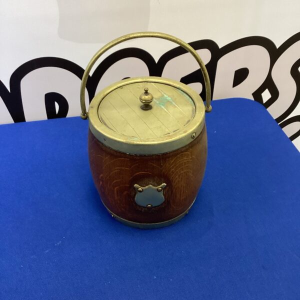 Vintage biscuit barrel with floral ceramic lid.