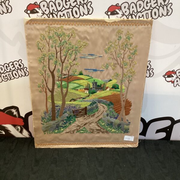 Detailed vintage silk tapestry of a county landscape scene.