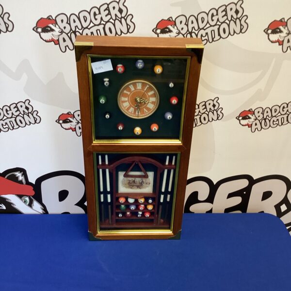 Vintage pool ball wall clock with colourful design.