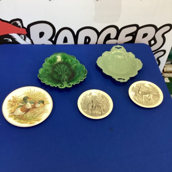 Lot of five vintage Wedgwood collectors plates with floral designs.