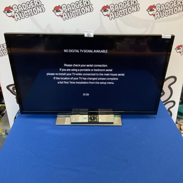 32 inch Toshiba flatscreen TV with built-in DVD player.