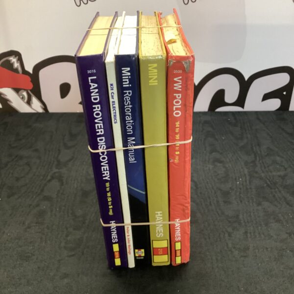 Lot of four Haynes car repair manuals.