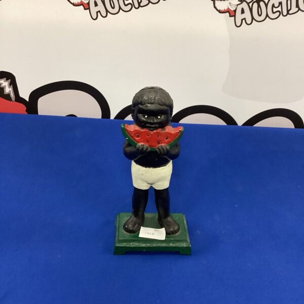 Vintage Robertson's golliwog cast iron coin bank for collectors.