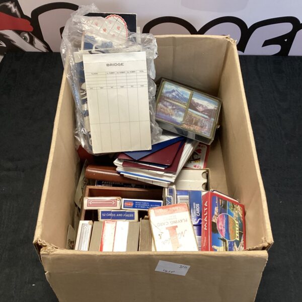 Vintage playing cards and bridge scoring books in a lot.
