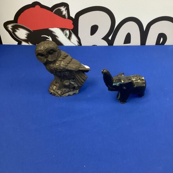 Vintage metal owl and elephant figurines for collectors.