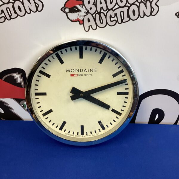 Vintage Mondaine Swiss Railway clock with clear white dial.