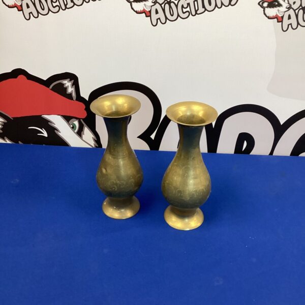 Pair of vintage Indian copper vases with detailed designs.