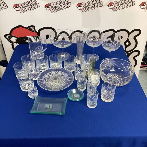 Assortment of vintage cut glass pieces on display.