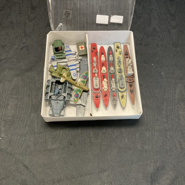 Vintage Matchbox diecast battleships and aircraft in a tray.