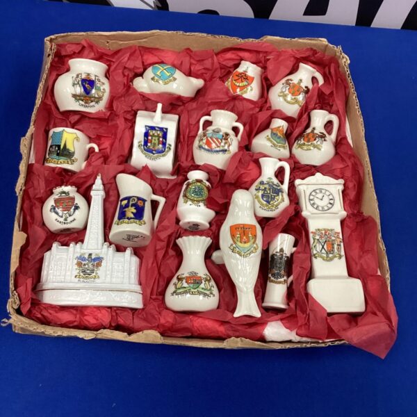 Selection of miniature china ornaments with crests and coats of arms.