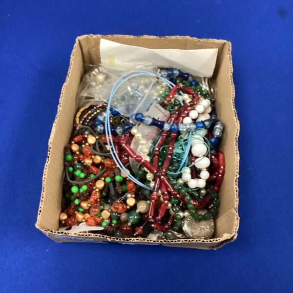 Colourful costume jewellery lot with bead necklaces and fashion accessories.
