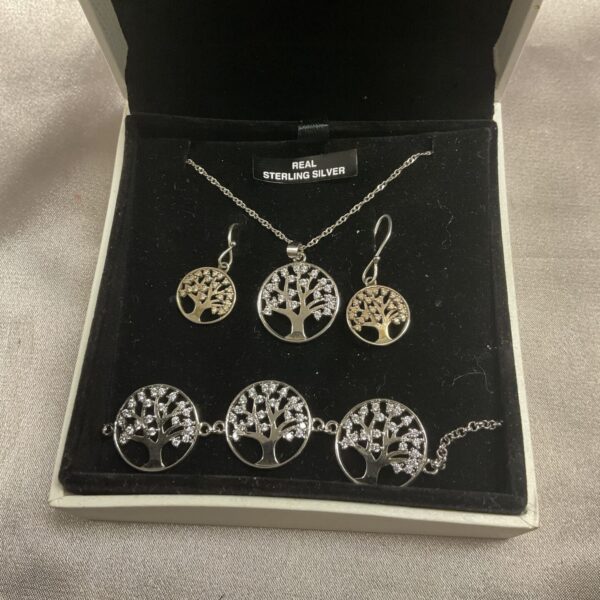 Silver Tree of Life jewellery set including necklace, bracelet and earrings.