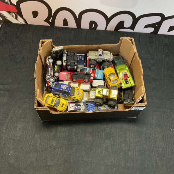 Mixed lot of diecast model cars and toy vehicles.