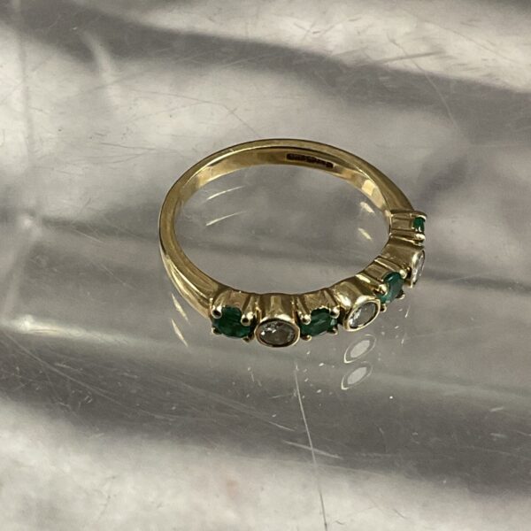 9ct gold ring with emeralds and diamonds, size M.