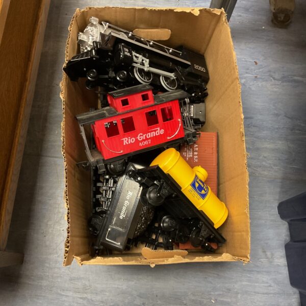 Red and black Rio Grande garden gauge train set with remote control.