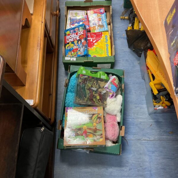 Overview of mixed toy and book lot with various items visible.