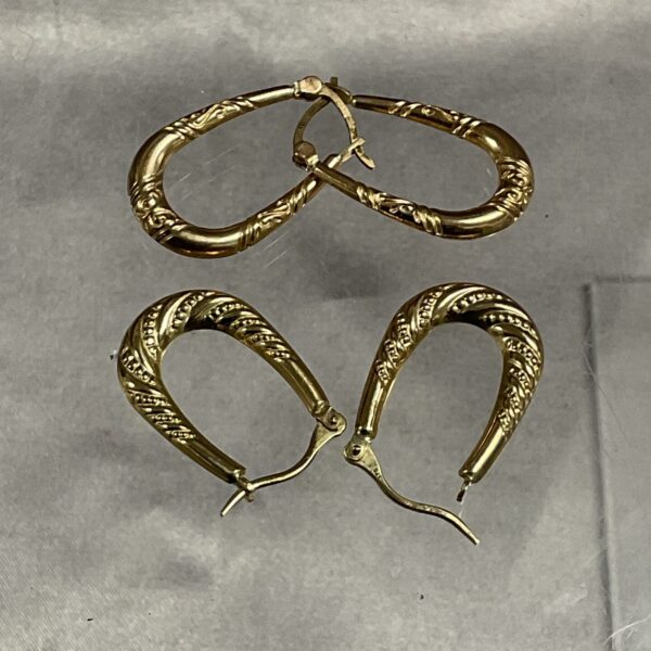 Close-up of 9ct gold horseshoe earrings, vintage style.
