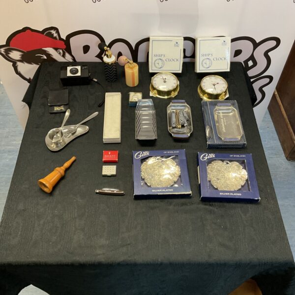 Vintage ships clocks and perfume atomisers in a mixed lot.