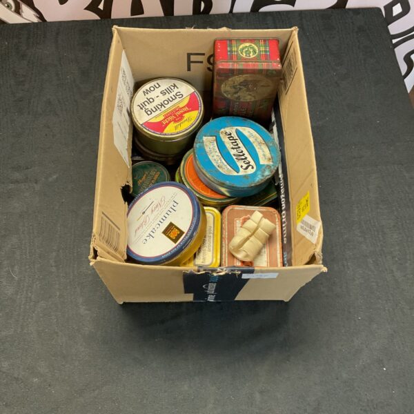 Close-up of a collection of colourful vintage tins.