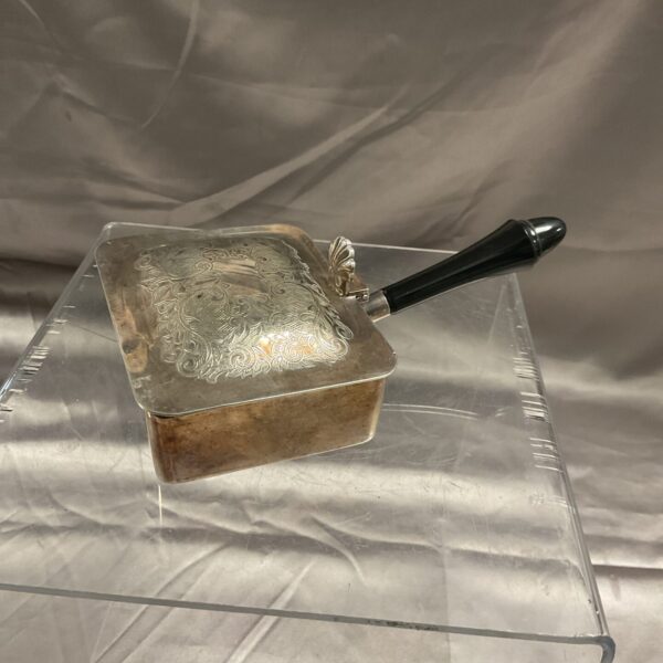 Antique Irish silver crumb tray with embossed detailing.