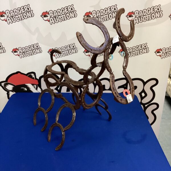 Rustic reindeer ornament made from repurposed horseshoes.
