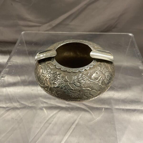 Intricately engraved Indian silver ashtray with floral design.
